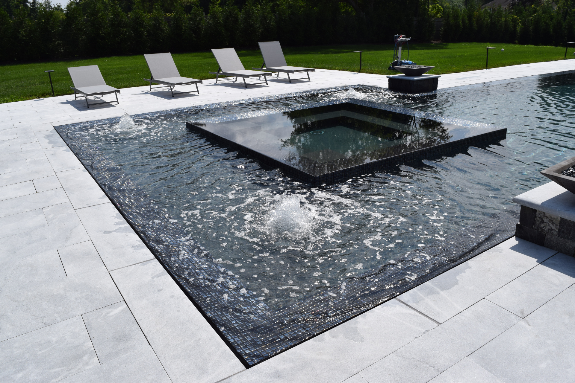 Luxury estate pool and patio with Mountain Smoke sandblasted marble — completed installation